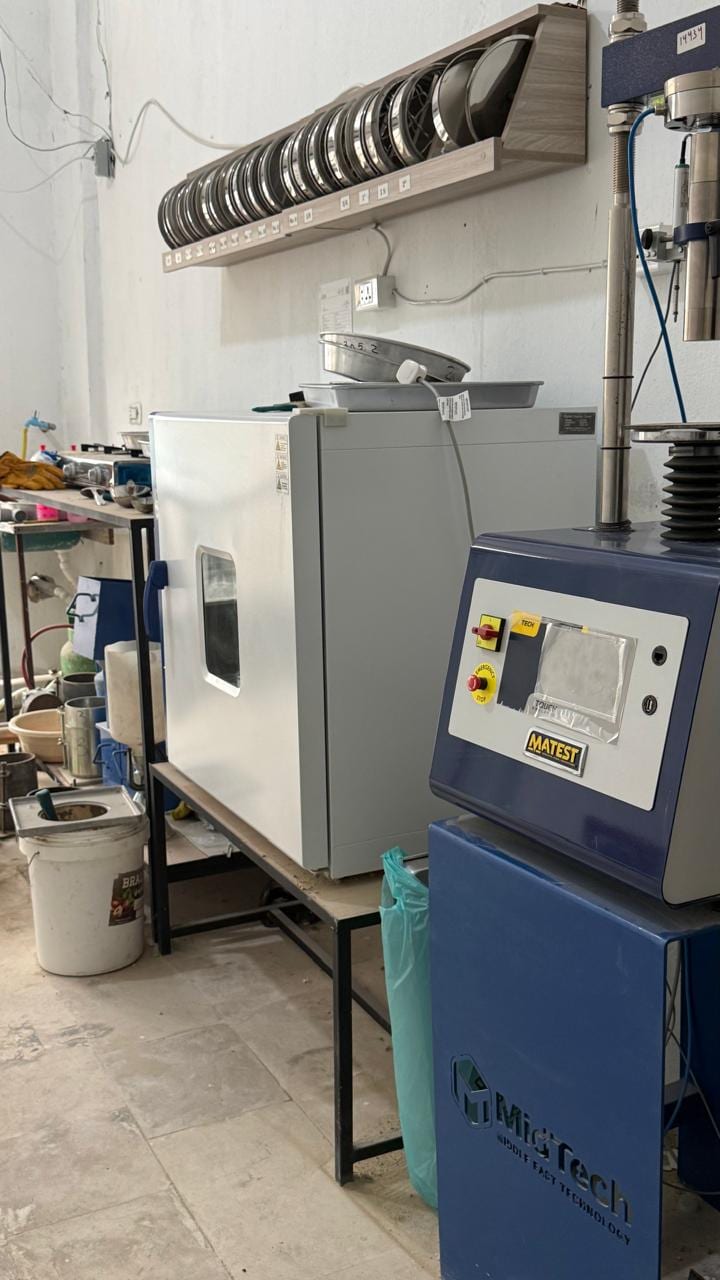 The lab: drying oven, sieve stack and the press
